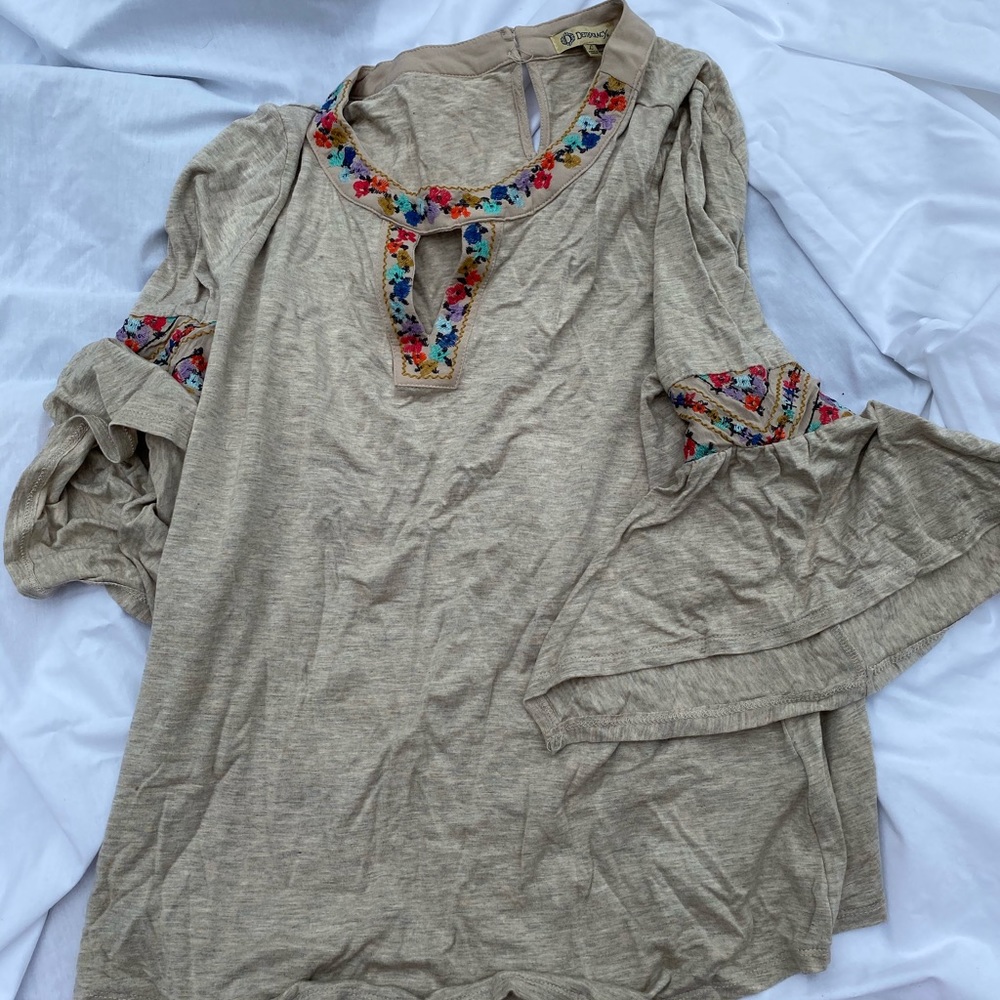 Tan/cream 3/4 sleeve top. Embroidery on neckline